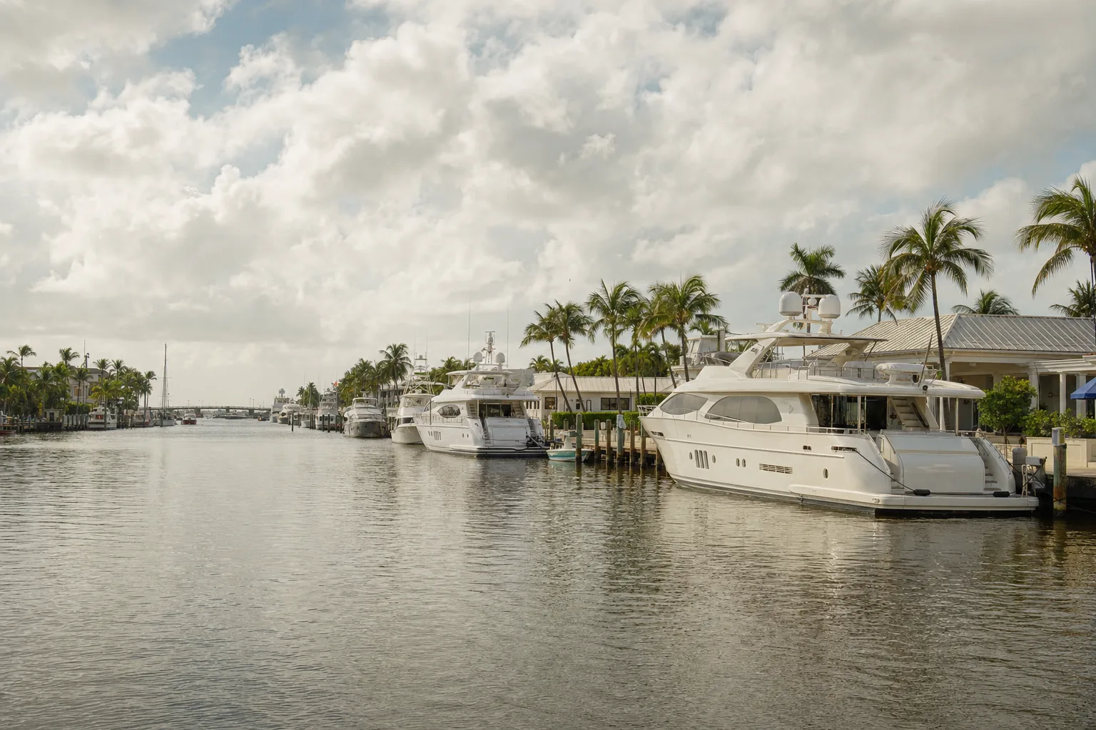 Yachts along a Florida waterway in humid afternoon light